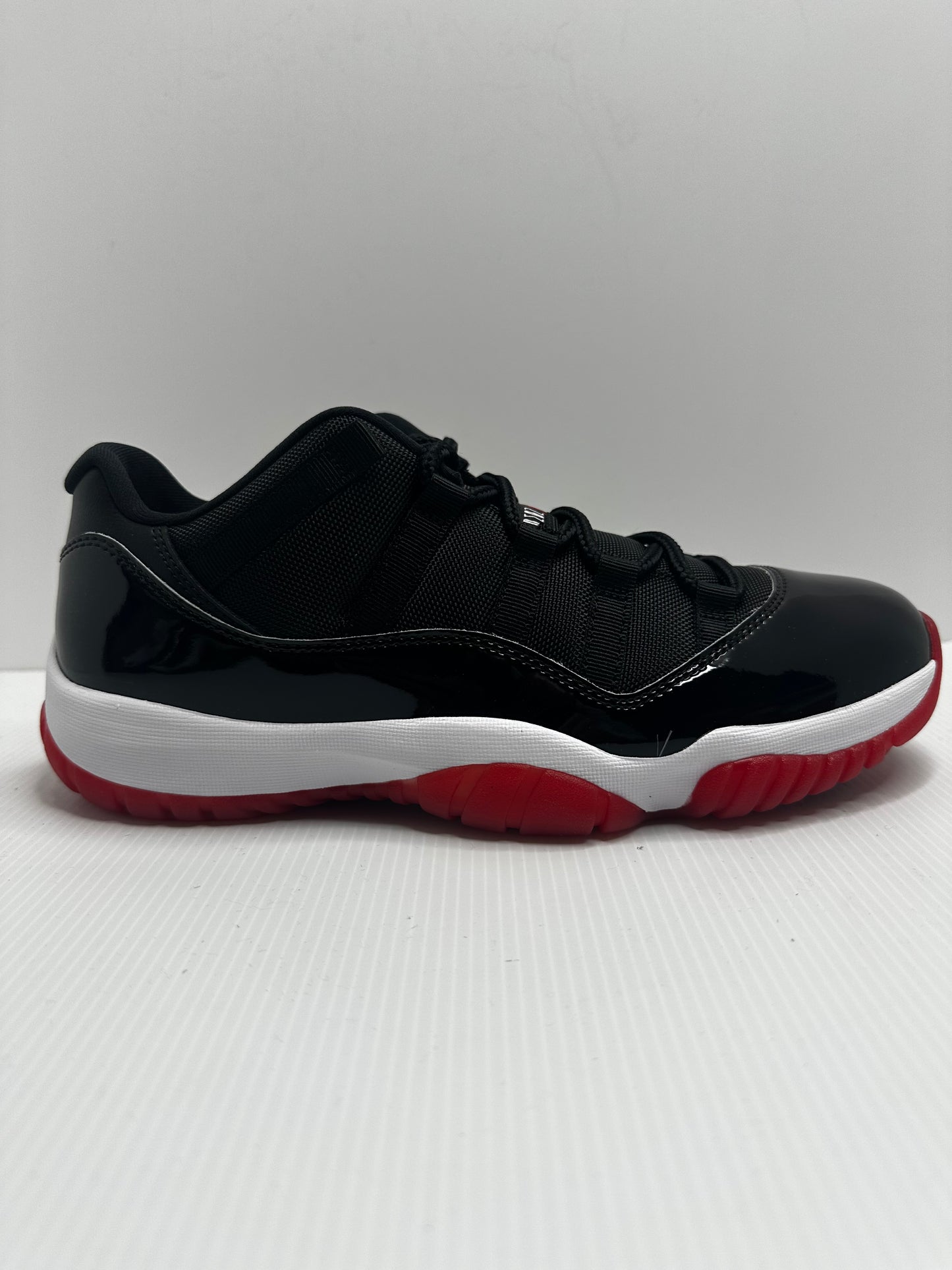 Jordan 11 Retro Low Bred (2025) - Black/Red/White