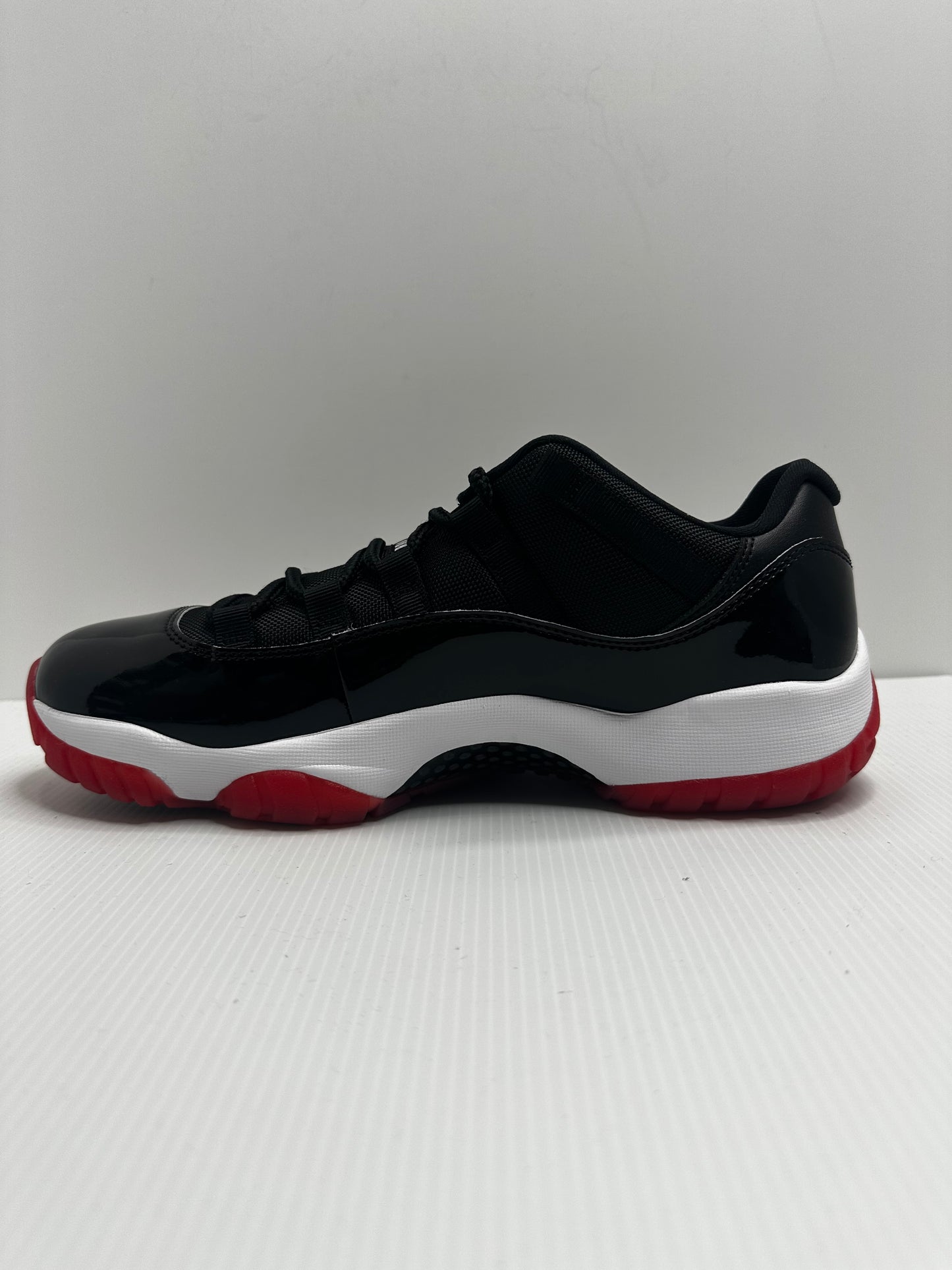 Jordan 11 Retro Low Bred (2025) - Black/Red/White