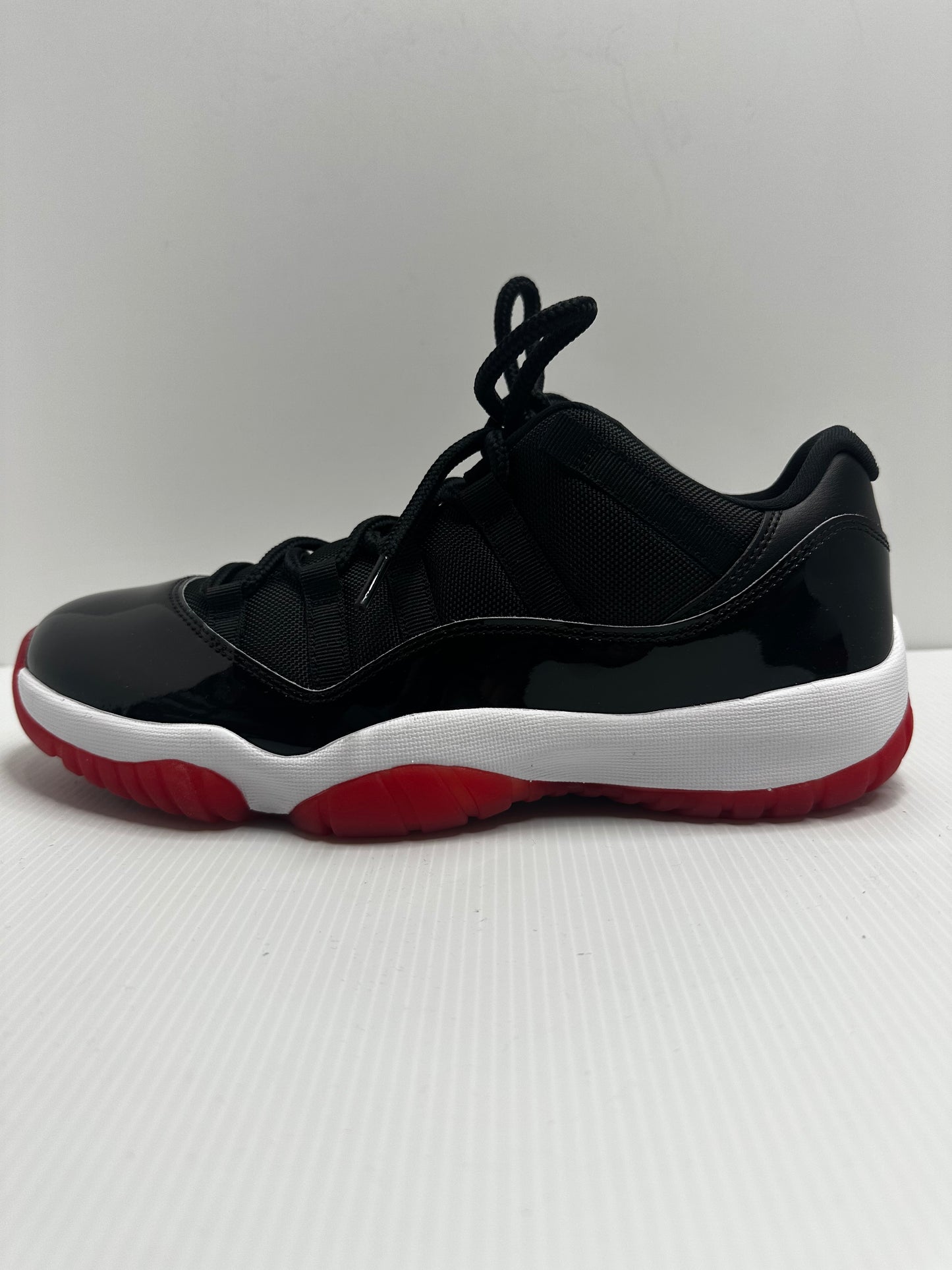 Jordan 11 Retro Low Bred (2025) - Black/Red/White