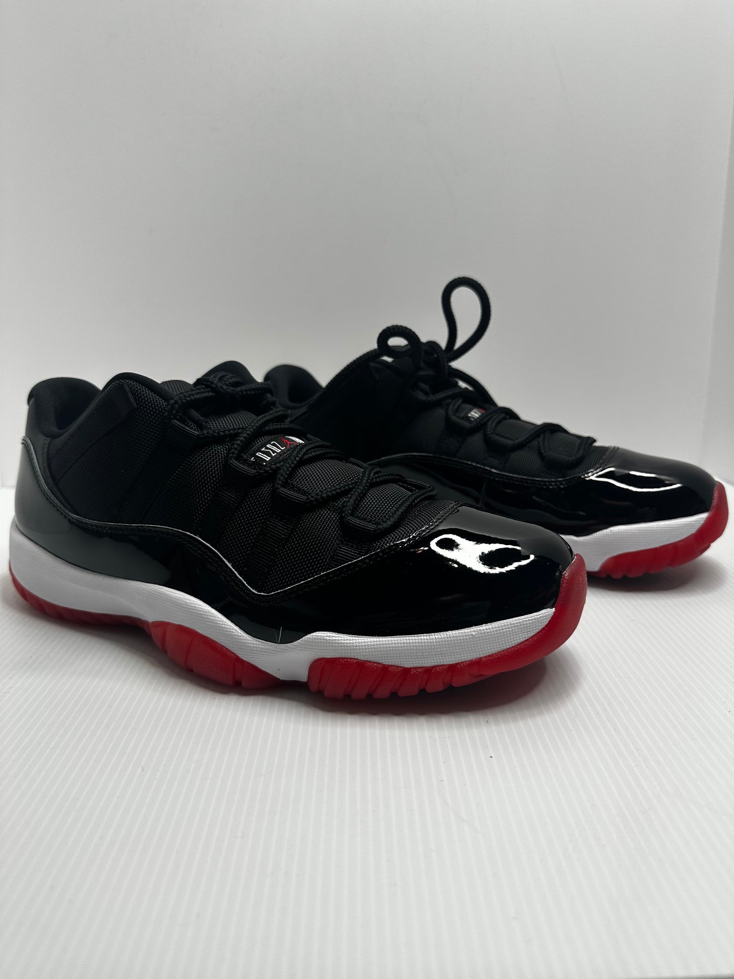 Jordan 11 Retro Low Bred (2025) - Black/Red/White