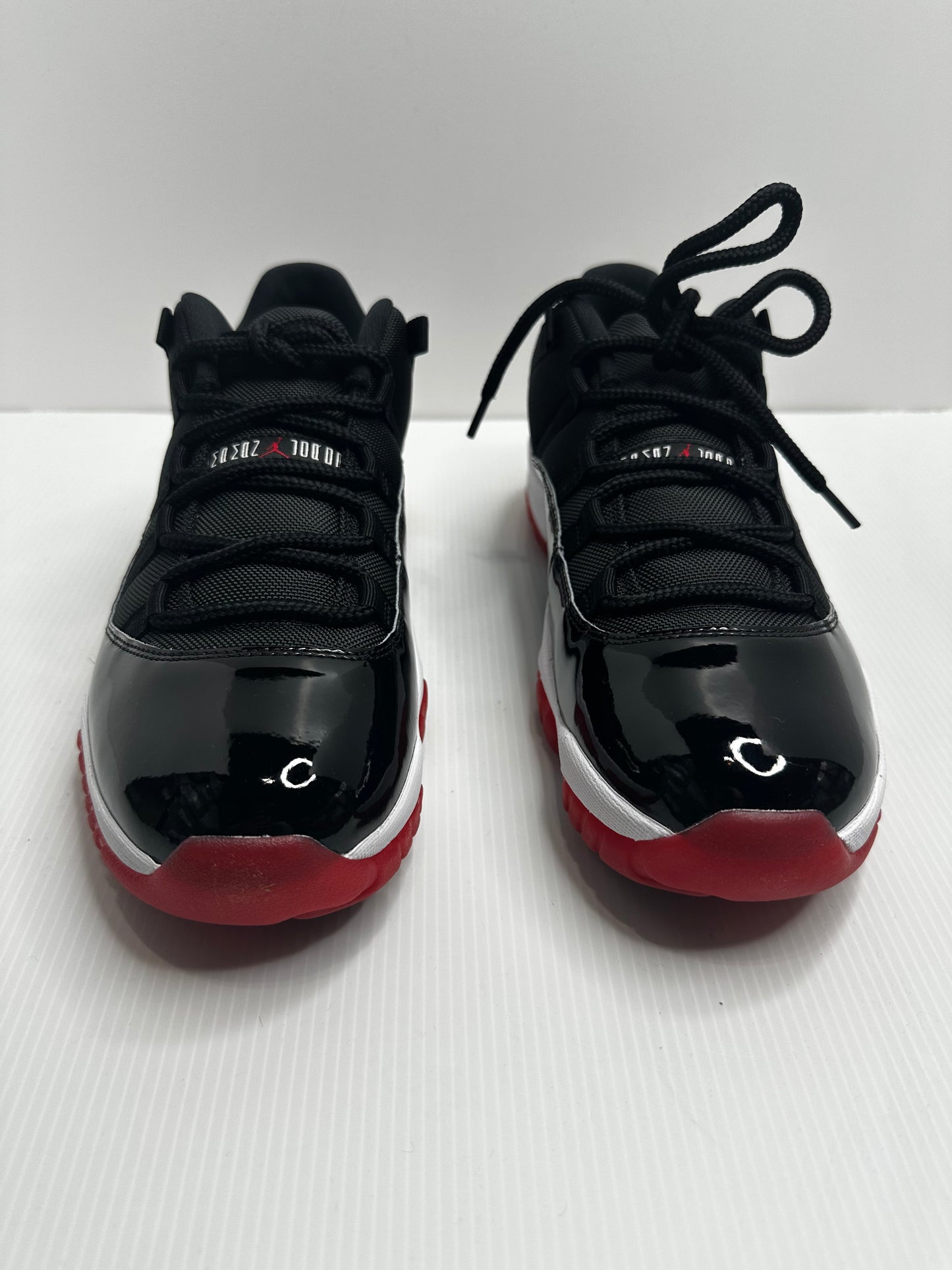 Jordan 11 Retro Low Bred (2025) - Black/Red/White