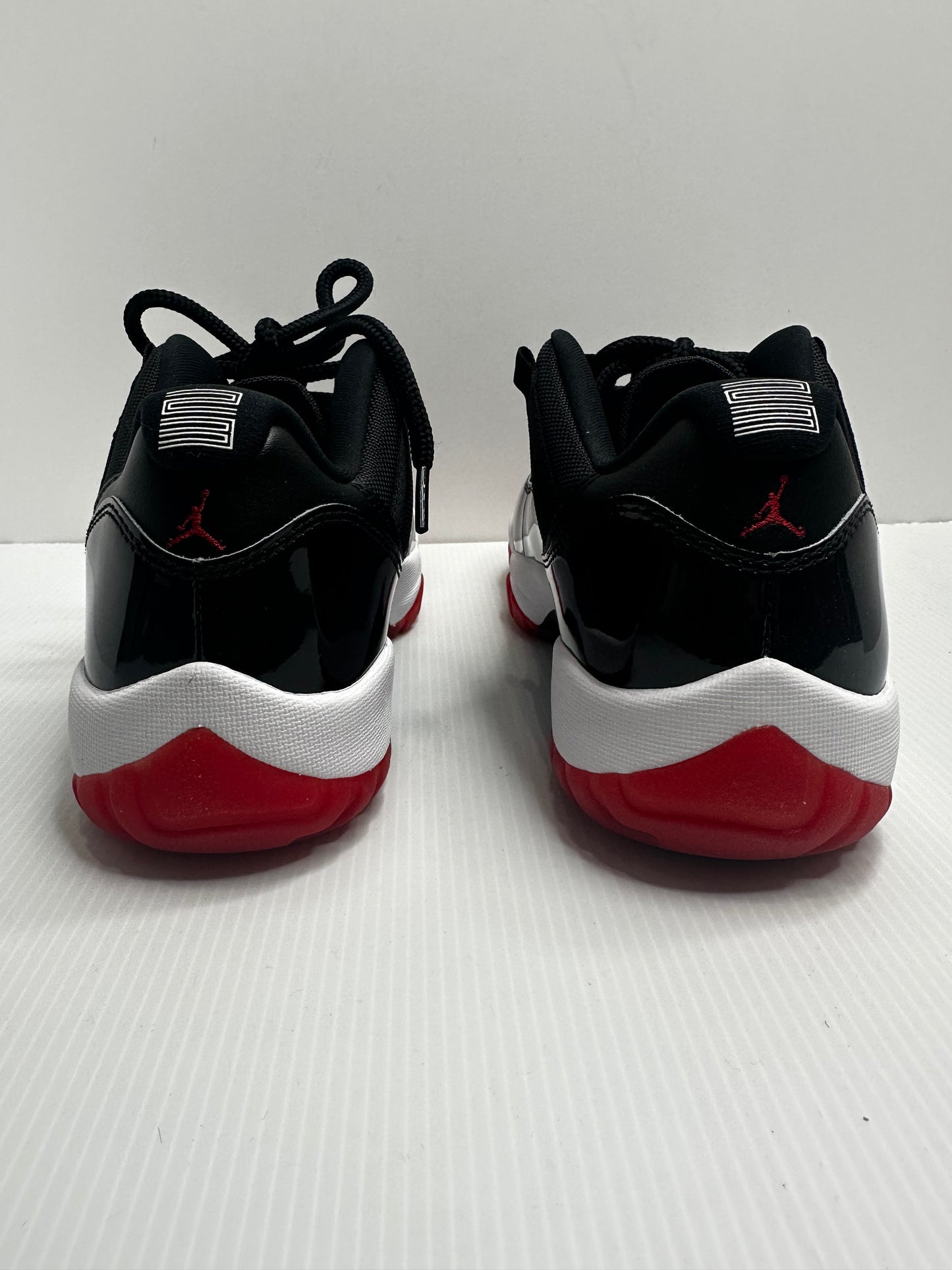 Jordan 11 Retro Low Bred (2025) - Black/Red/White